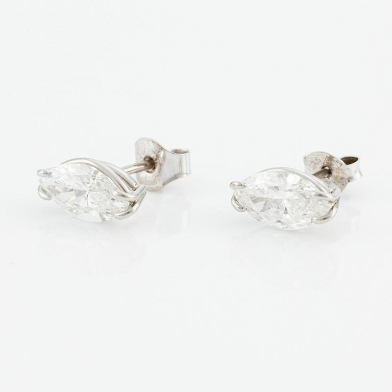 A pair of 18K white gold Chopard earrings set with two marquise-shaped diamonds.