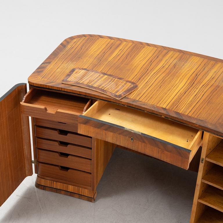 A zebrano veneered Swedish Modern desk, mid 20th Century.