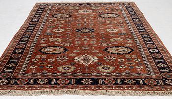 A semi-antique Orientall carpet c. 318 x 202 cm.