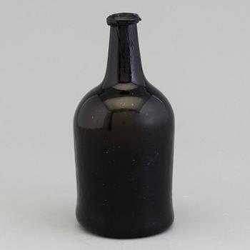 An 18th Century glass bottle.