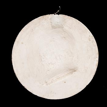 A plaster medallion dated 1893.