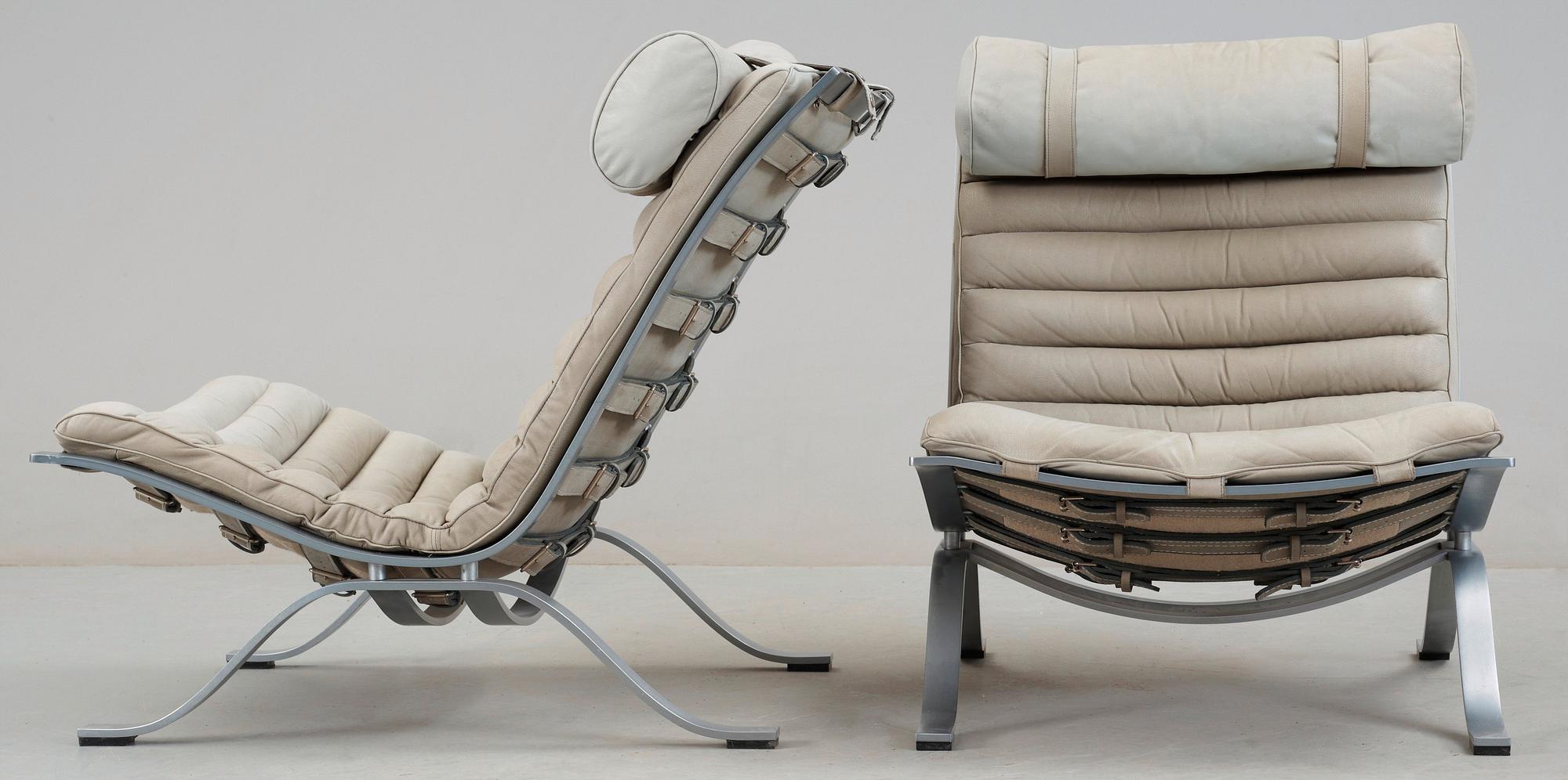 A pair of Arne Norell Ari grey leather lounge chairs Norell Sweden. Bukowskis