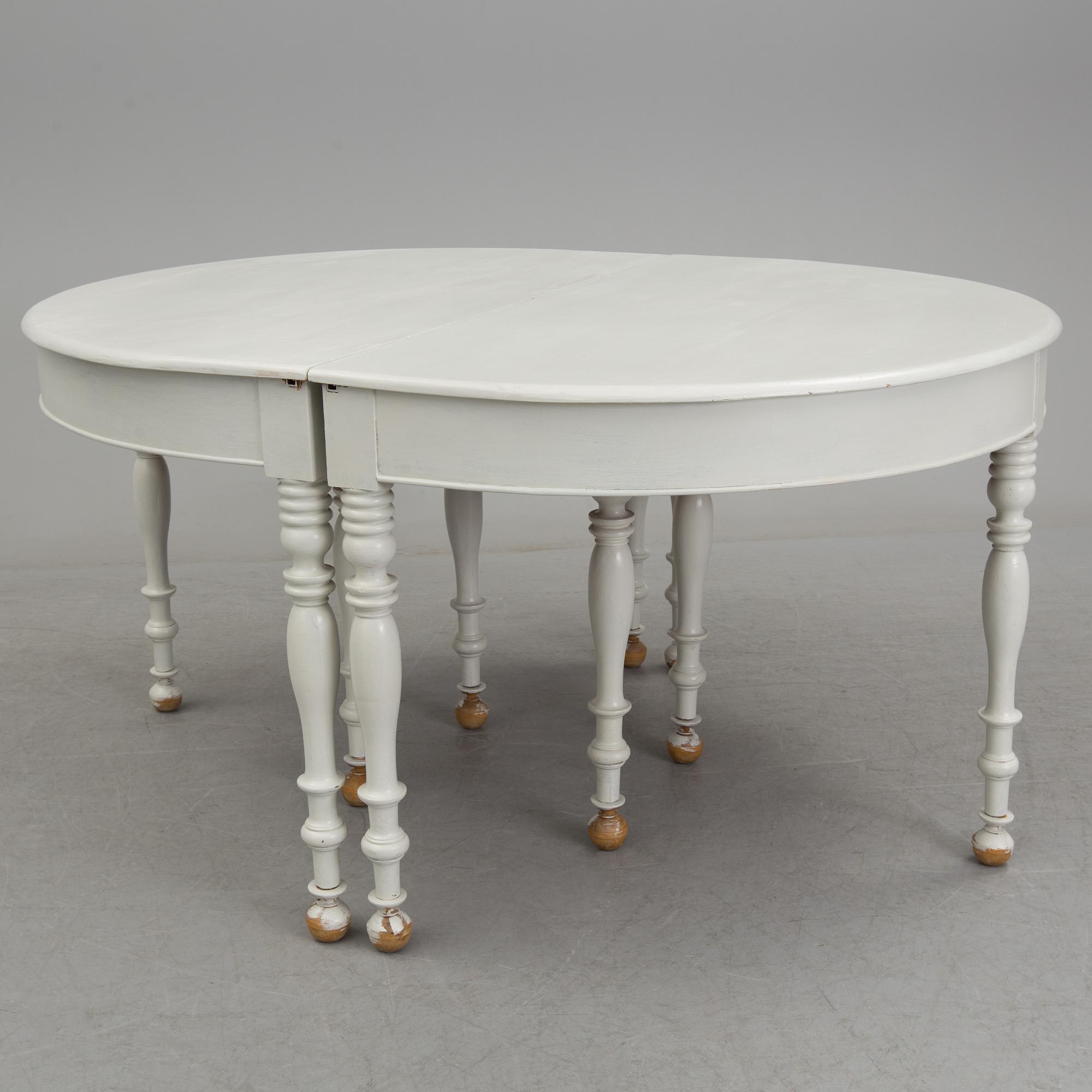 A mid 19th century dining table with six extension leaves.