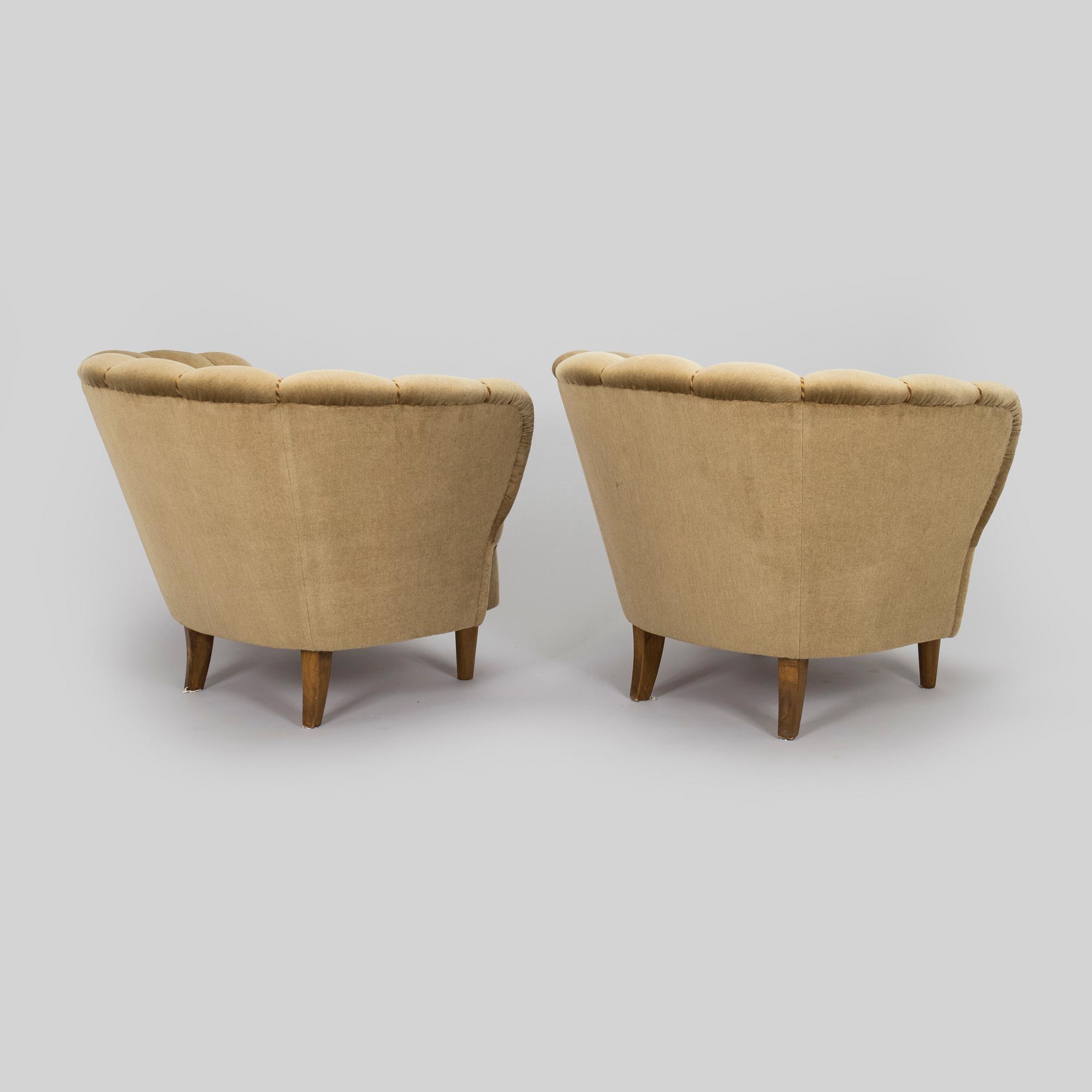 A pair of mid-20th century armchairs.