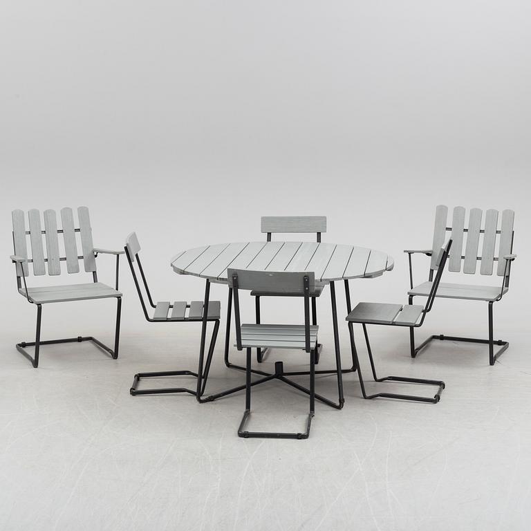 A garden table and six chairs, second half of  the 20th century.