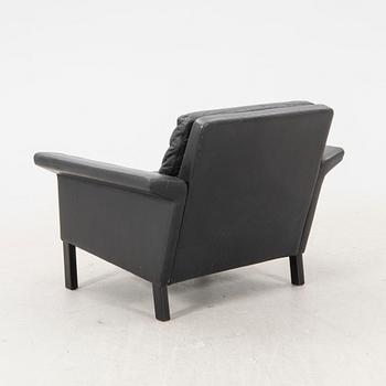 A 1960/70s Hans Olsen leather armchair.
