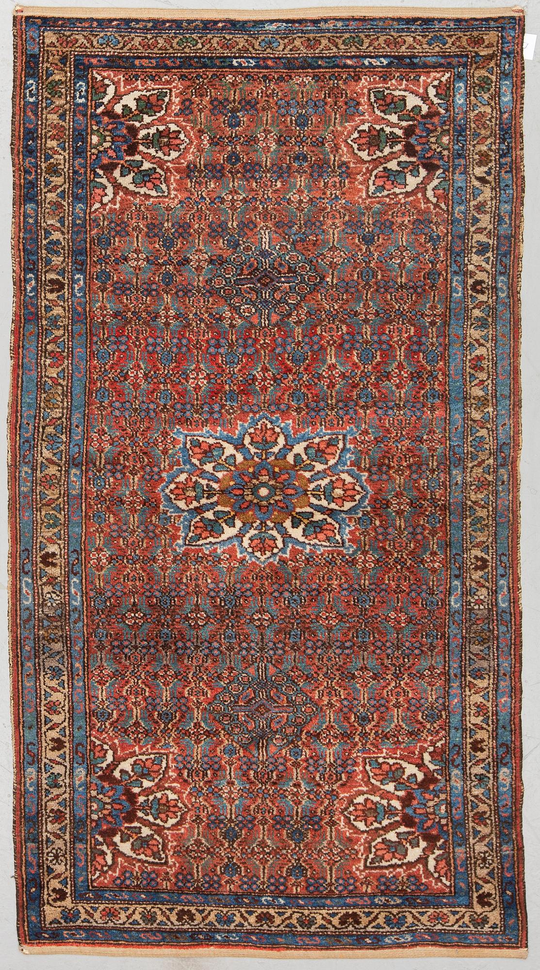 A RUG, semi-antique Hamadan, ca 200 x 117 cm.