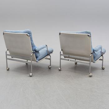 A pair of easy chairs with stool by Bruno Mathsson, DUX, late 20th century.