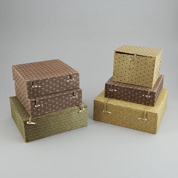 A set of six silk clad boxes, China, 20th Century.