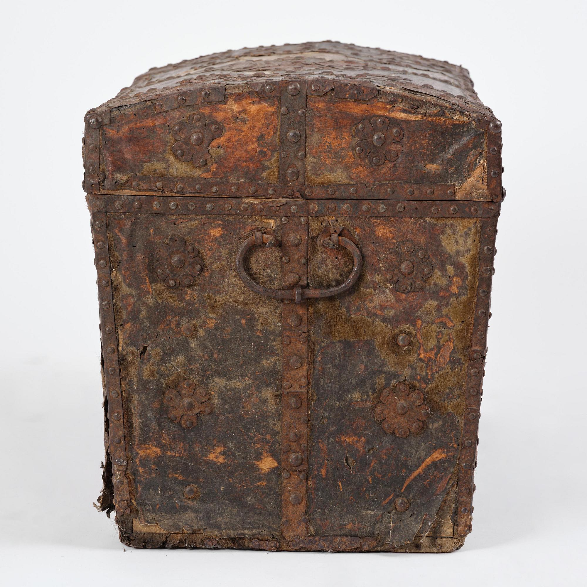 A Dutch baroque iron-bound and leather clad chest, later part 17th century.