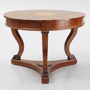 A mahogany veneered Empire style table, first half the 20th Century.