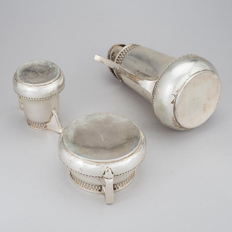 A three piece silver coffe set by firma Karl Anderson Stockholm 1905. Total weight c. 1200 gram.