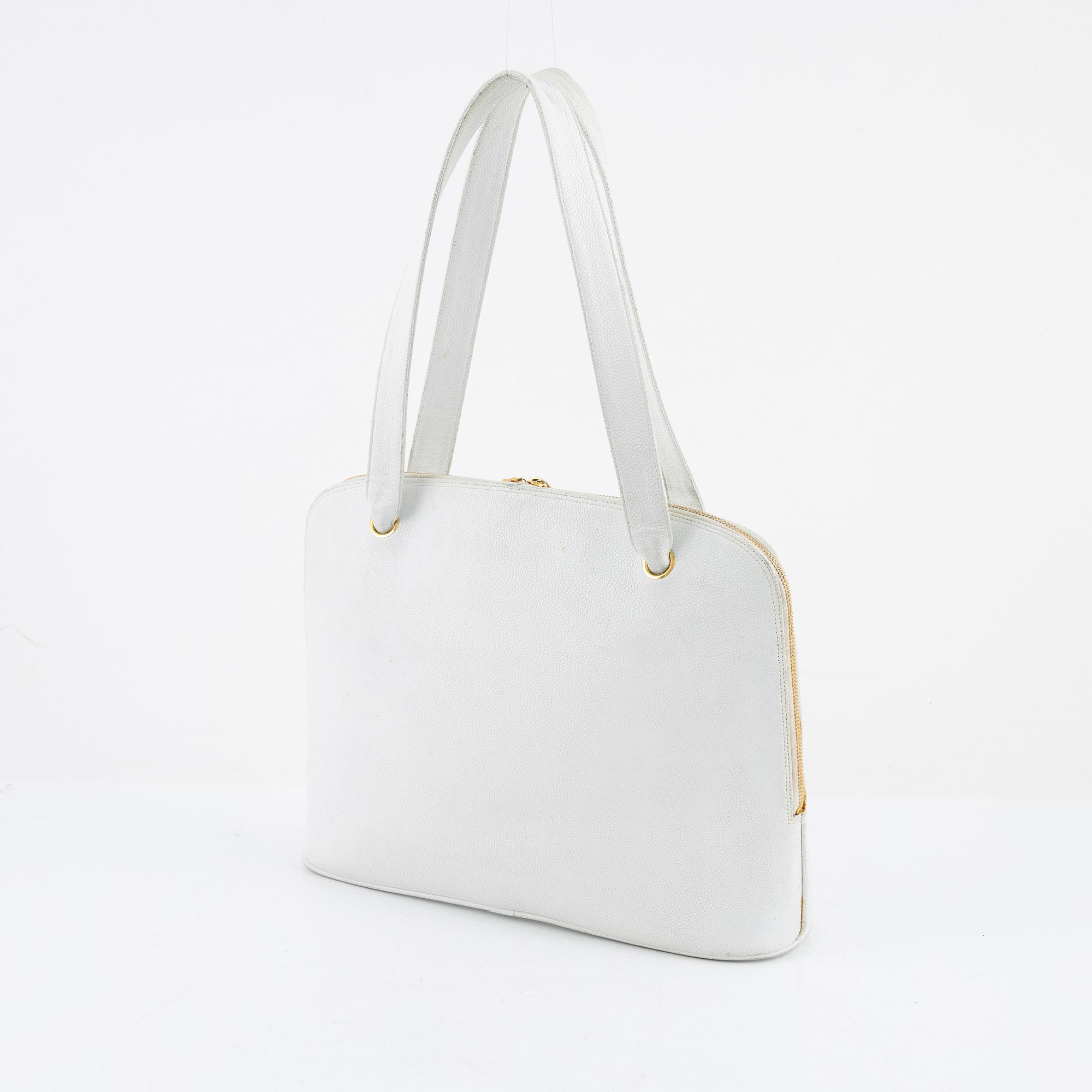 Chanel, a white caviar vintage bag.