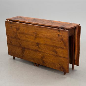 A 19th century folk art drop leaf table.