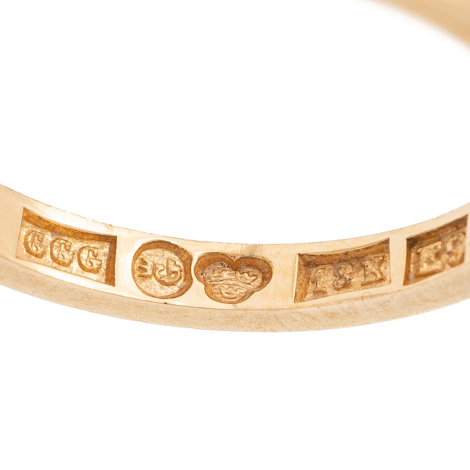 18K gold half-eternity ring with octagonal-cut diamonds.