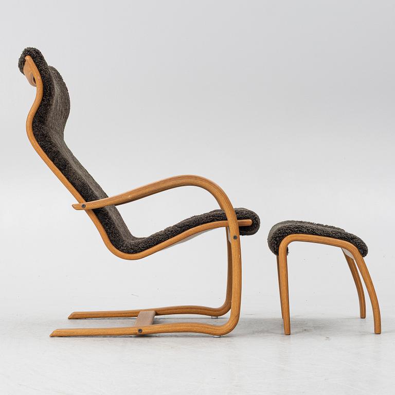 Jan Ekström, a "Gazell" armchair with a footstool, 21st century.
