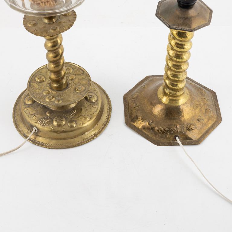 Two Baroque style brass table lamps from around the year 1900.