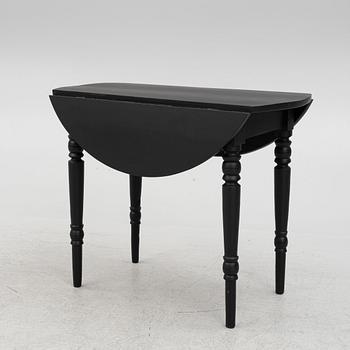 A drop-leaf table, late 19th century.