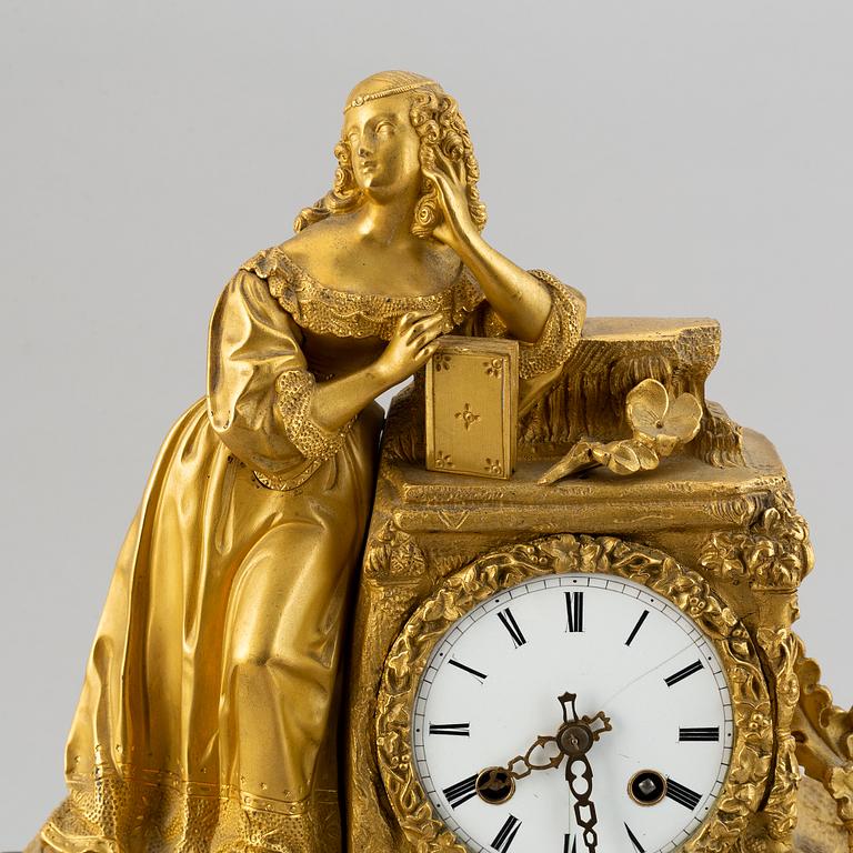 A rococo style brass mantle clock, second half of the 19th Century.