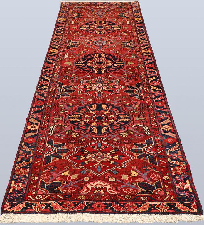 A semi-antique Heriz runner, c. 340 x 92 cm.