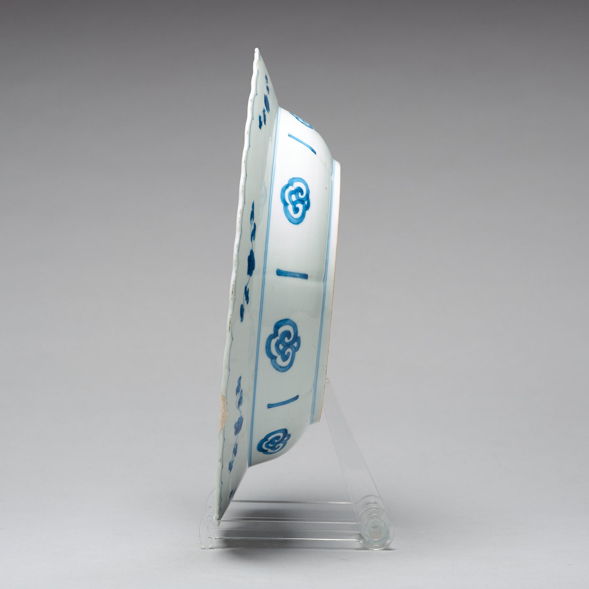 A large blue and white deep dish, Qing dynasty, with Kangxi six character mark and period (1662-1722).