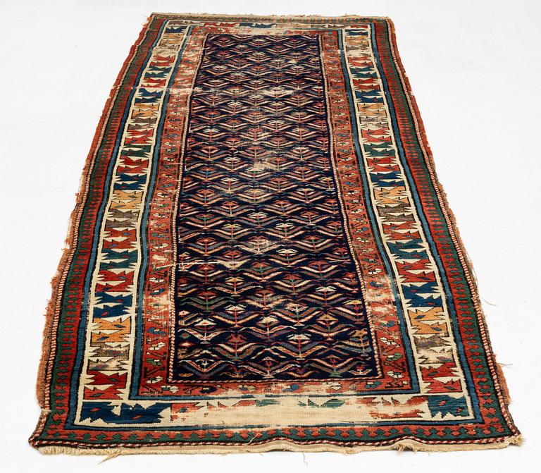 A antique Kazak gallery carpet, ca 310 x 105 cm.