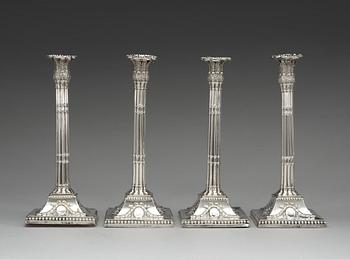 A set of four English silver candlesticks, marks of William Holmes, London 1772.