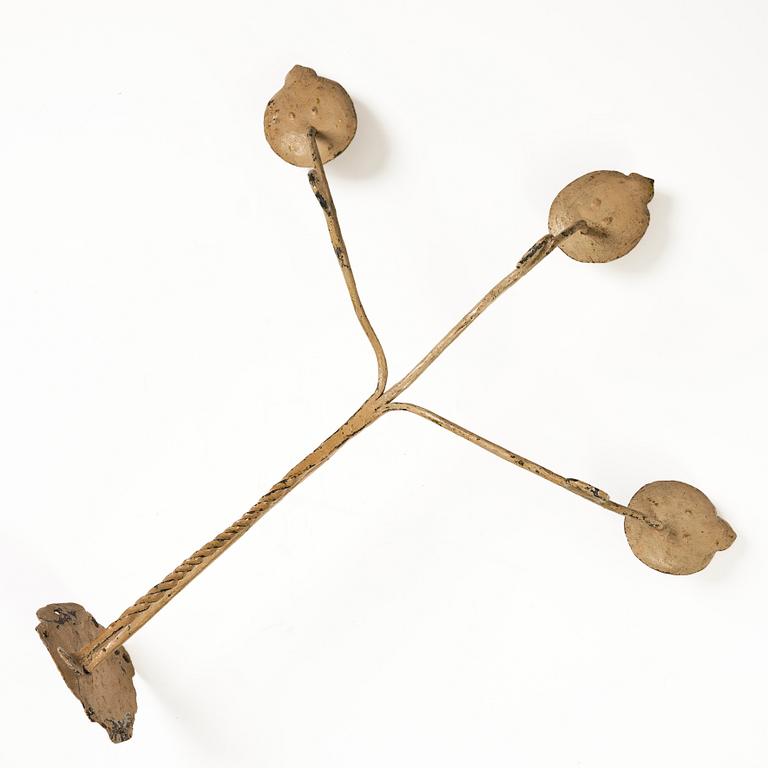 A Swedish wrought iron three-branch wall light, 17th / 18th century.
