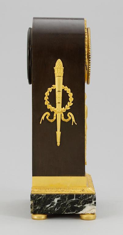 A French Empire mantel clock by A. A. Ravrio.