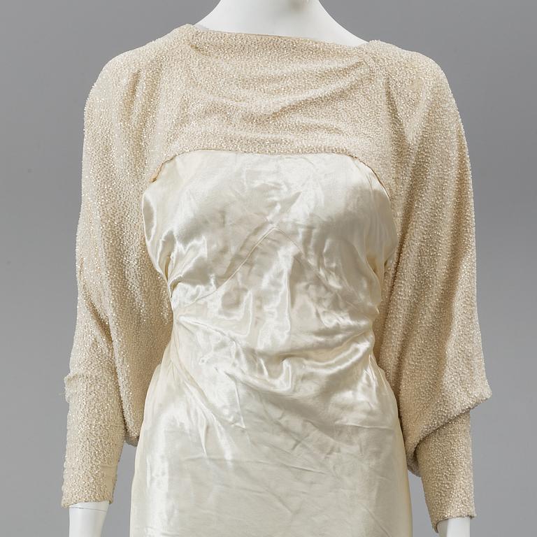 A satin wedding dress, circa 1935.