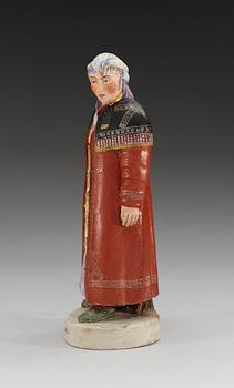 A Russian bisquit figure depicting a Khanty woman, Gardner ca 1924.