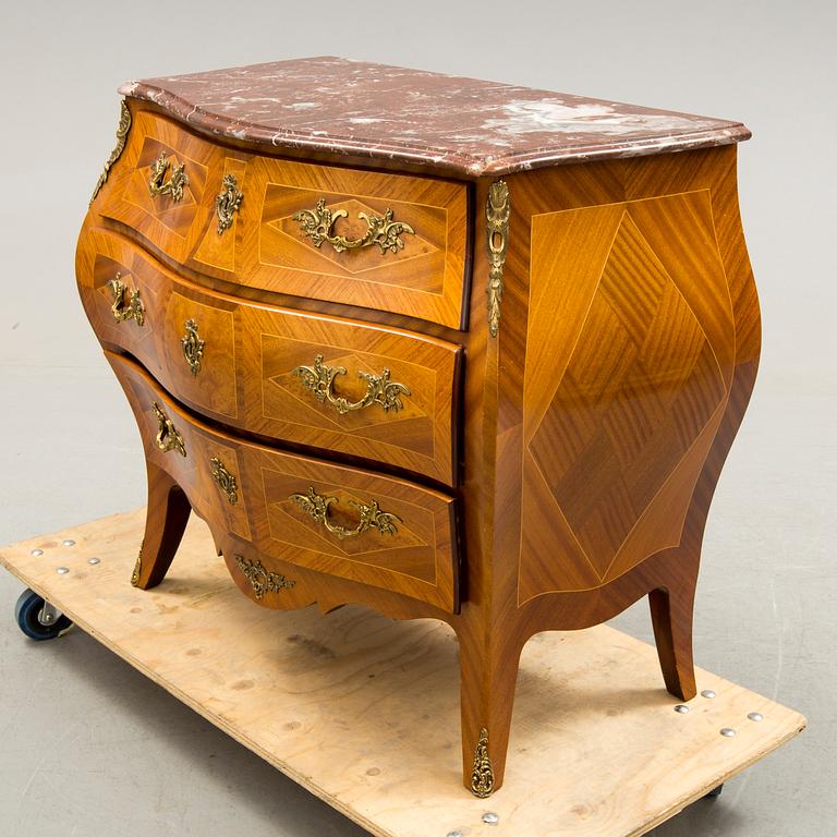 A Rococo-style chest of drawers, mid 20th century.