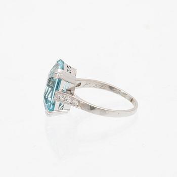 A platinum ring set with a square step cut aquamarin and single cut diamonds CG Hallberg Stockholm 1948.