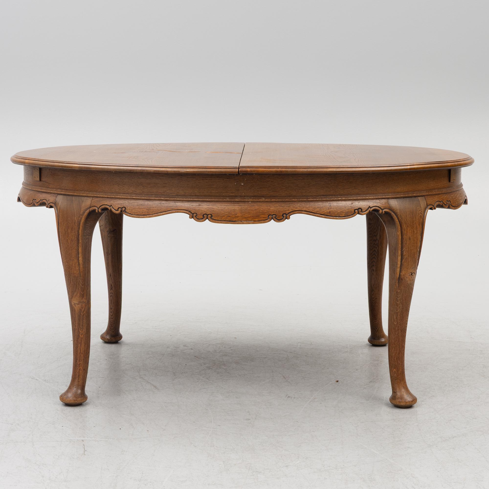 Dining table, 8 chairs, 2 armchairs, sideboard, Rococo style, early 20th century.