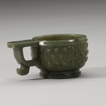 A Chinese archaistic carved nephrite cup.