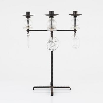 Erik Höglund, a iron and glass candelabra.