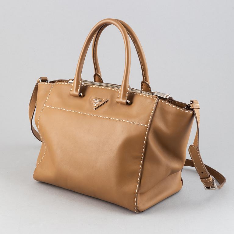 Prada, a leather handbag.