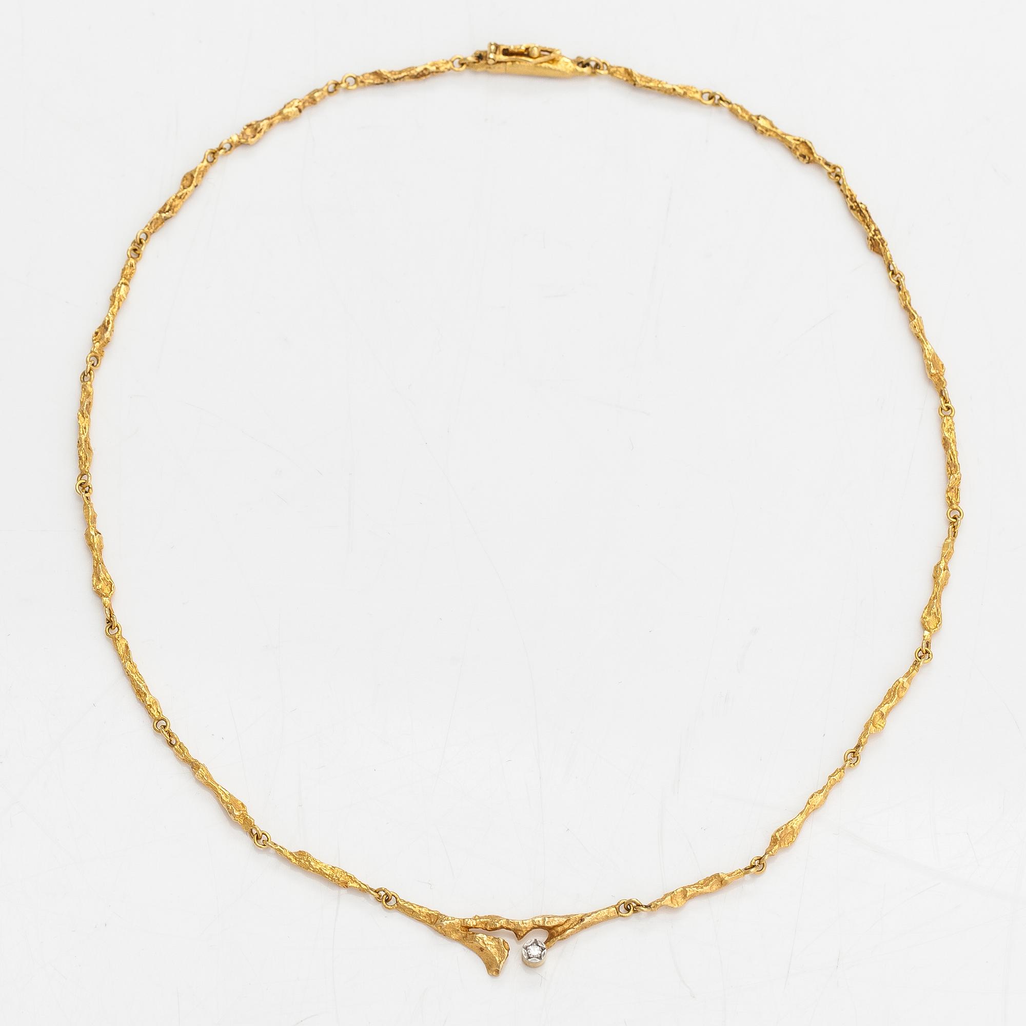 Björn Weckström, An 18K gold necklace "Spring dew" with a ca. 0.08 ct diamond. Lapponia 1979.