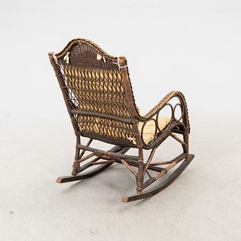 A rattan and bamboo rocking chair around 1900.