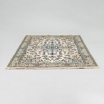 A carpet, Nain Part Silk. Ca 185 x 123 cm.