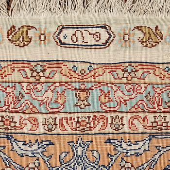 A carpet, an old silk Turkey, ca 237,5 x 146,5  cm (as well as 3,5-4 cm flat weave at the ends).