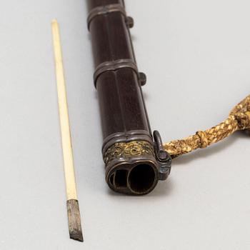 A knife and chopsticks in a scabbard, late Qing dynasty.