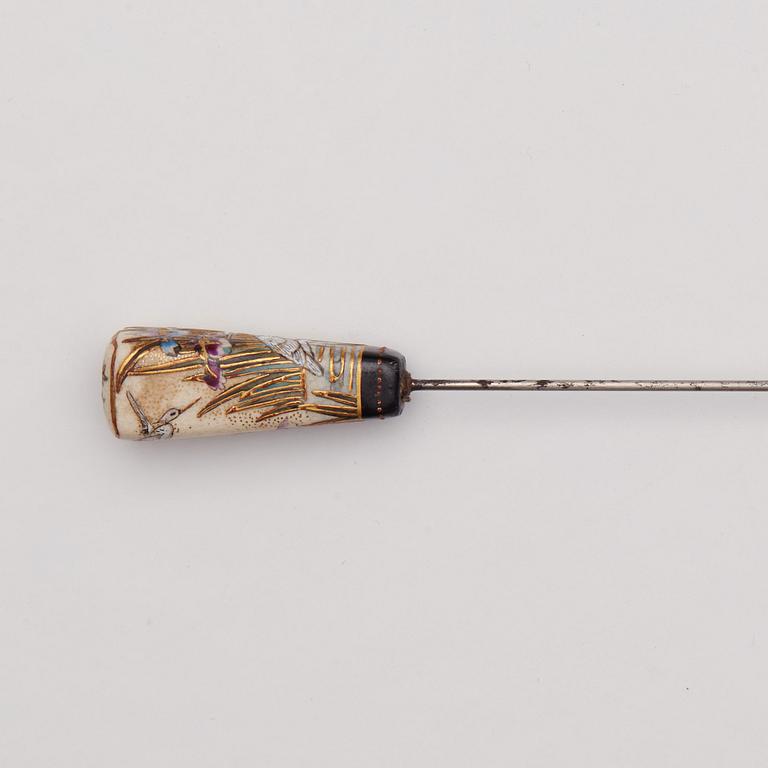 A Japanese painted hat pin, Meiji (1868-1912).