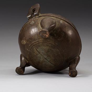 A bronze tripod censer, presumably Han dynasty (206 B.C-220 A.D).