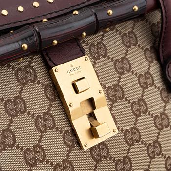 Gucci, a monogram canvas bag.