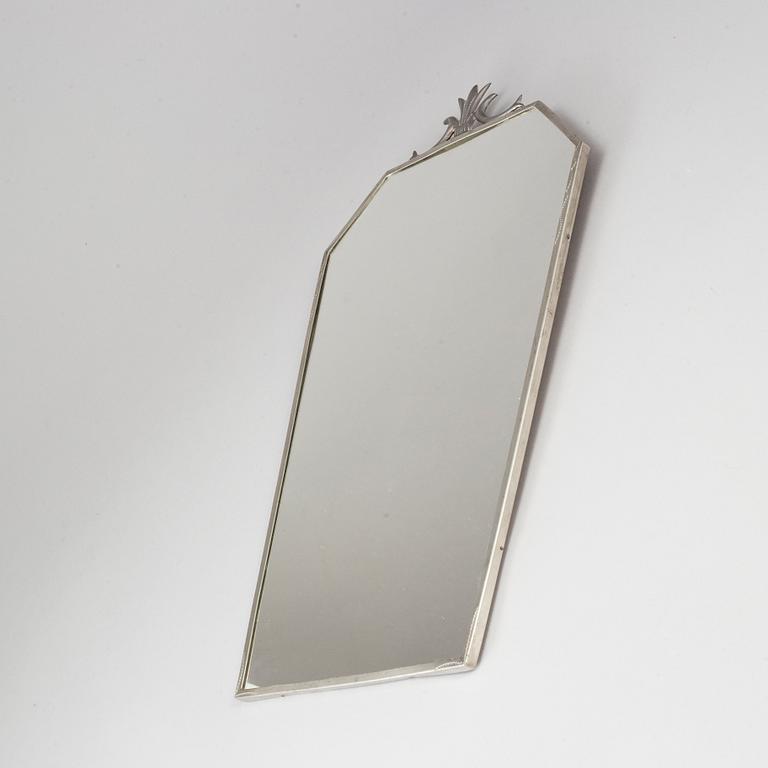A pewter Art Deco mirror and a pair of wall scones, 1930s.