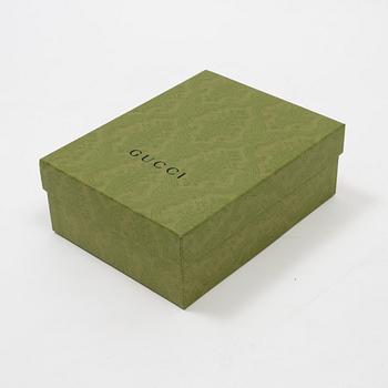 Gucci, a 'Flora' silk scarf.