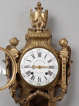 A Louis XVI late 18th century gilt bronze wall clock.