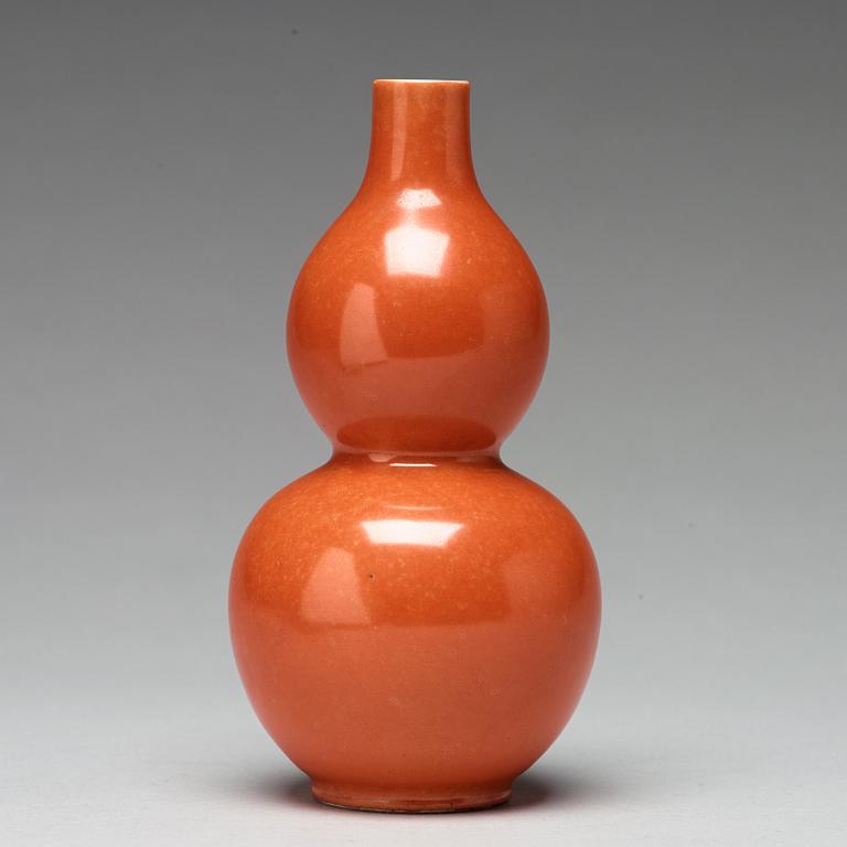 A coral red calebass shaped vase, Qing dynasty with Jiaqing mark (1796-1820).