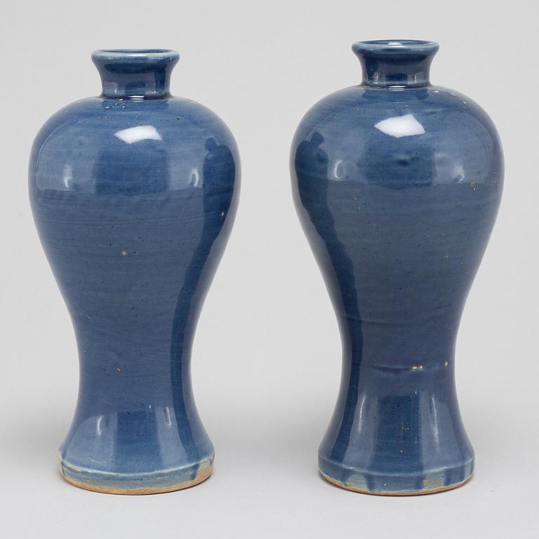 A pair of blue glazed meiping vases, 17th Century.